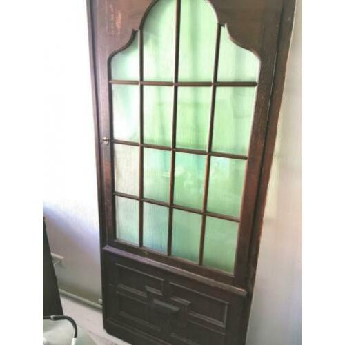 Sale Oude deur met mooi houtsnijwerk en openslaand glas